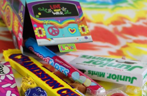 Tie-dye table with boxes of candy and chocolate bars